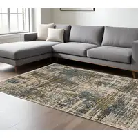 Photo of Blue And Gold Abstract Distressed Area Rug With Fringe