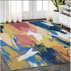 Photo of Blue And Gold Abstract Distressed Area Rug