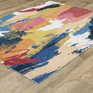 Photo of Blue And Gold Abstract Distressed Area Rug