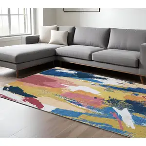 Photo of Blue And Gold Abstract Distressed Area Rug