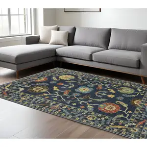 Photo of Blue And Gold Oriental Area Rug With Fringe