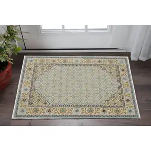 Photo of Blue And Gold Oriental Area Rug With Fringe