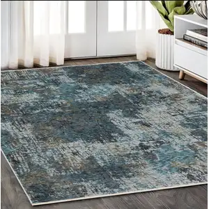 Photo of Blue And Gray Abstract Distressed Area Rug With Fringe