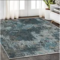 Photo of Blue And Gray Abstract Distressed Area Rug With Fringe