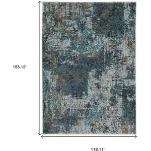 Photo of Blue And Gray Abstract Distressed Area Rug With Fringe