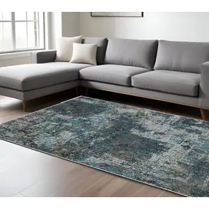 Photo of Blue And Gray Abstract Distressed Area Rug With Fringe