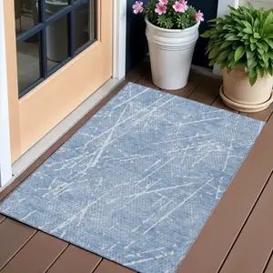 Photo of Blue And Ivory Abstract Washable Indoor Outdoor Area Rug