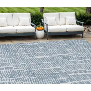 Photo of Blue And Ivory Abstract Washable Indoor Outdoor Area Rug