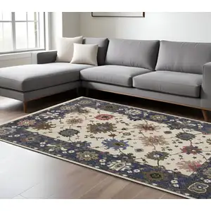 Photo of Blue And Ivory Floral Area Rug With Fringe