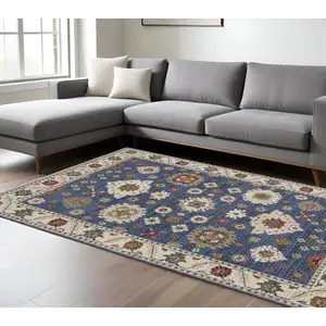 Photo of Blue And Ivory Floral Area Rug With Fringe