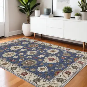 Photo of Blue And Ivory Floral Area Rug With Fringe