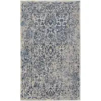 Photo of Blue And Ivory Floral Power Loom Distressed Area Rug