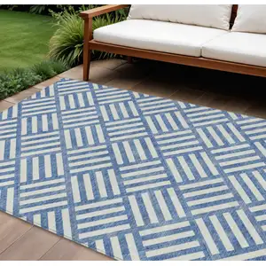 Photo of Blue And Ivory Geometric Washable Indoor Outdoor Area Rug