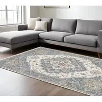 Photo of Blue And Ivory Medallion Distressed Area Rug With Fringe