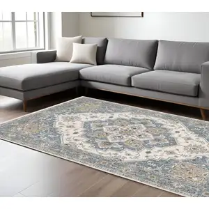 Photo of Blue And Ivory Medallion Distressed Area Rug With Fringe