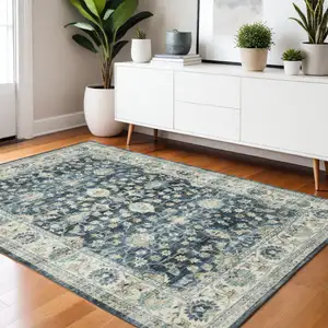 Photo of Blue And Ivory Oriental Distressed Area Rug