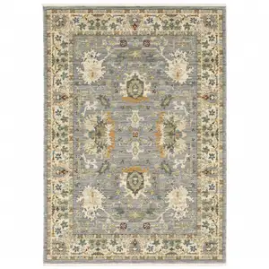 Photo of Blue And Ivory Oriental Power Loom Stain Resistant Area Rug With Fringe