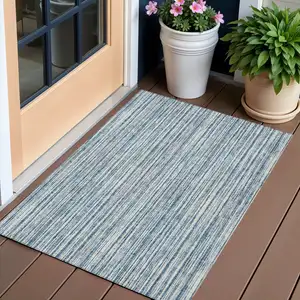 Photo of Blue And Ivory Striped Washable Indoor Outdoor Area Rug