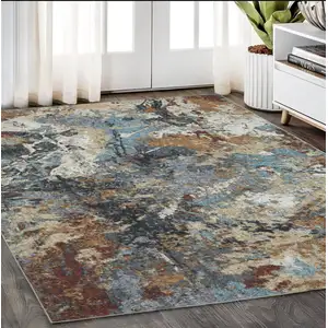 Photo of Blue And Rust Abstract Distressed Area Rug