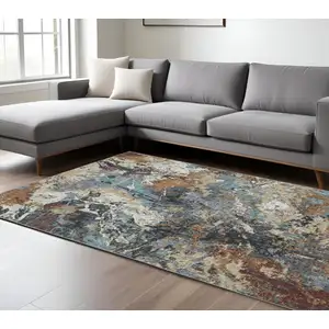 Photo of Blue And Rust Abstract Distressed Area Rug