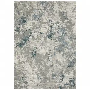 Photo of Blue Beige And Teal Abstract Power Loom Stain Resistant Area Rug