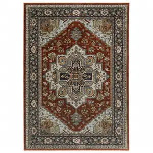 Photo of Blue Beige Grey Gold Green And Rust Red Oriental Power Loom Stain Resistant Area Rug With Fringe