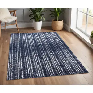 Photo of Blue Black and Ivory Power Loom Area Rug