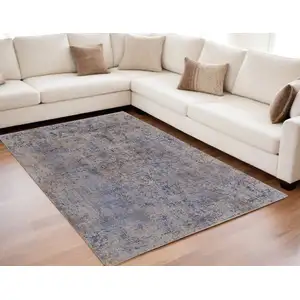 Photo of Blue Brown and Tan Abstract Power Loom Area Rug