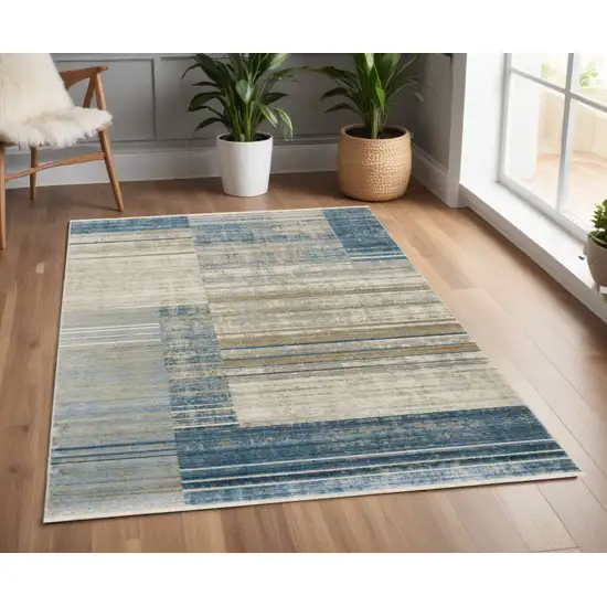 Blue Dark Blue Teal Grey Ivory Beige And Tan Geometric Power Loom Stain Resistant Area Rug With Fringe Photo 1