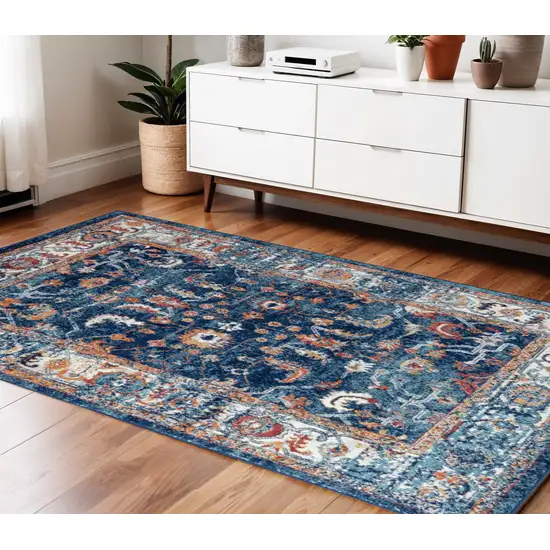 Blue Rust and Orange Floral Power Loom Area Rug Photo 1