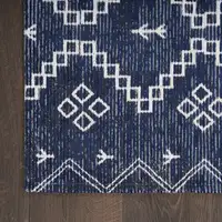 Photo of Blue Geometric Worn Faded Area Rug