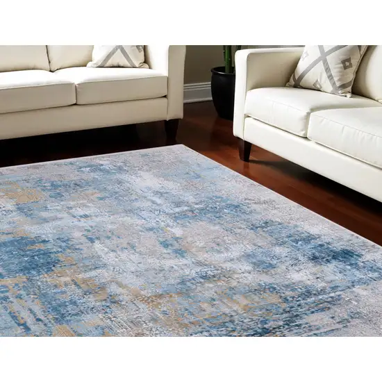 Blue Gold and Gray Abstract Power Loom Area Rug With Fringe Photo 1