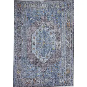 Photo of Blue Gray And Gold Floral Stain Resistant Area Rug