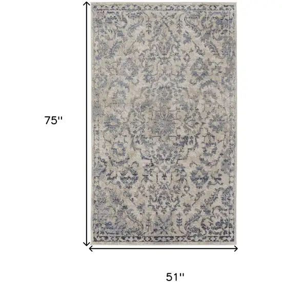 Blue Gray And Ivory Floral Power Loom Distressed Area Rug Photo 10