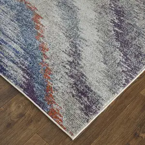 Photo of Blue Gray And Orange Abstract Power Loom Stain Resistant Area Rug