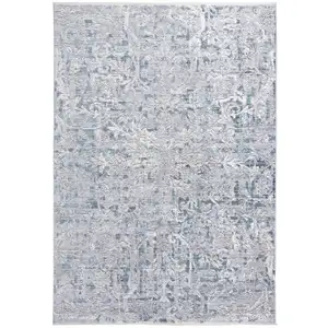 Photo of Blue Gray And Silver Abstract Distressed Area Rug With Fringe