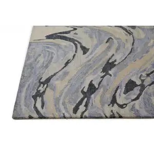 Photo of Blue Gray And Taupe Abstract Tufted Handmade Area Rug