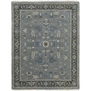 Photo of Blue Gray And Taupe Wool Floral Hand Knotted Stain Resistant Area Rug