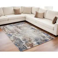 Photo of Blue Gray and Brown Abstract Power Loom Worn Faded Area Rug