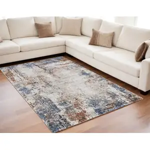 Photo of Blue Gray and Brown Abstract Power Loom Worn Faded Area Rug