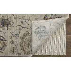 Photo of Blue Gray and Brown Floral Power Loom Worn Faded Area Rug With Fringe