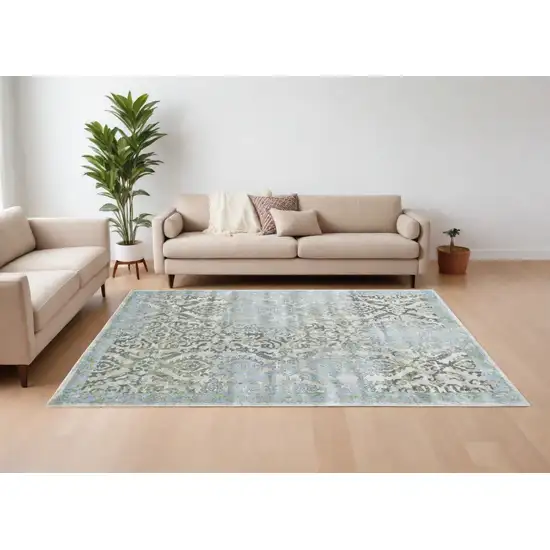 Blue Gray and Green Floral Power Loom Worn Faded Area Rug Photo 1