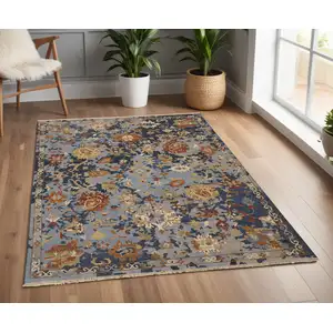 Photo of Blue Gray and Red Wool Floral Hand Knotted Area Rug With Fringe