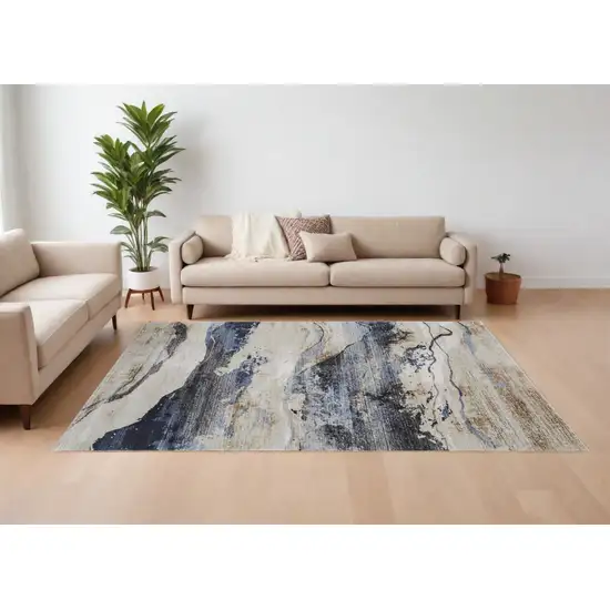 Blue Gray and Tan Abstract Power Loom Area Rug Photo 1