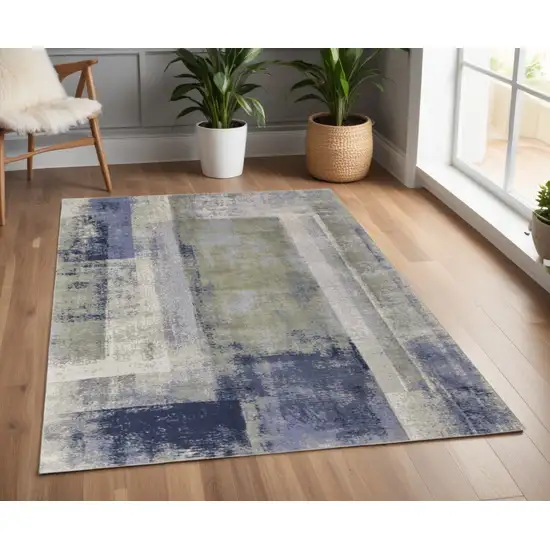 Blue and Ivory Abstract Power Loom Distressed Area Rug Photo 1