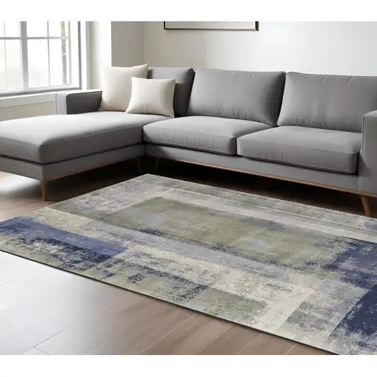 Blue and Ivory Abstract Power Loom Distressed Area Rug Photo 1