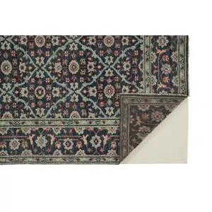 Photo of Blue Green And Red Wool Floral Hand Knotted Distressed Stain Resistant Area Rug With Fringe