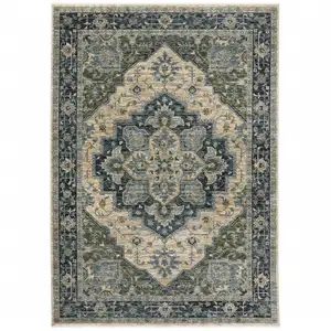 Photo of Blue Grey Beige Tan Green And Gold Oriental Power Loom Stain Resistant Area Rug With Fringe