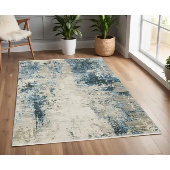 Blue Grey Ivory Light Blue And Dark Blue Abstract Power Loom Stain Resistant Area Rug With Fringe Photo 1