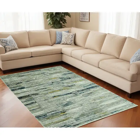 Ivory and Blue Abstract Area Rug Photo 1